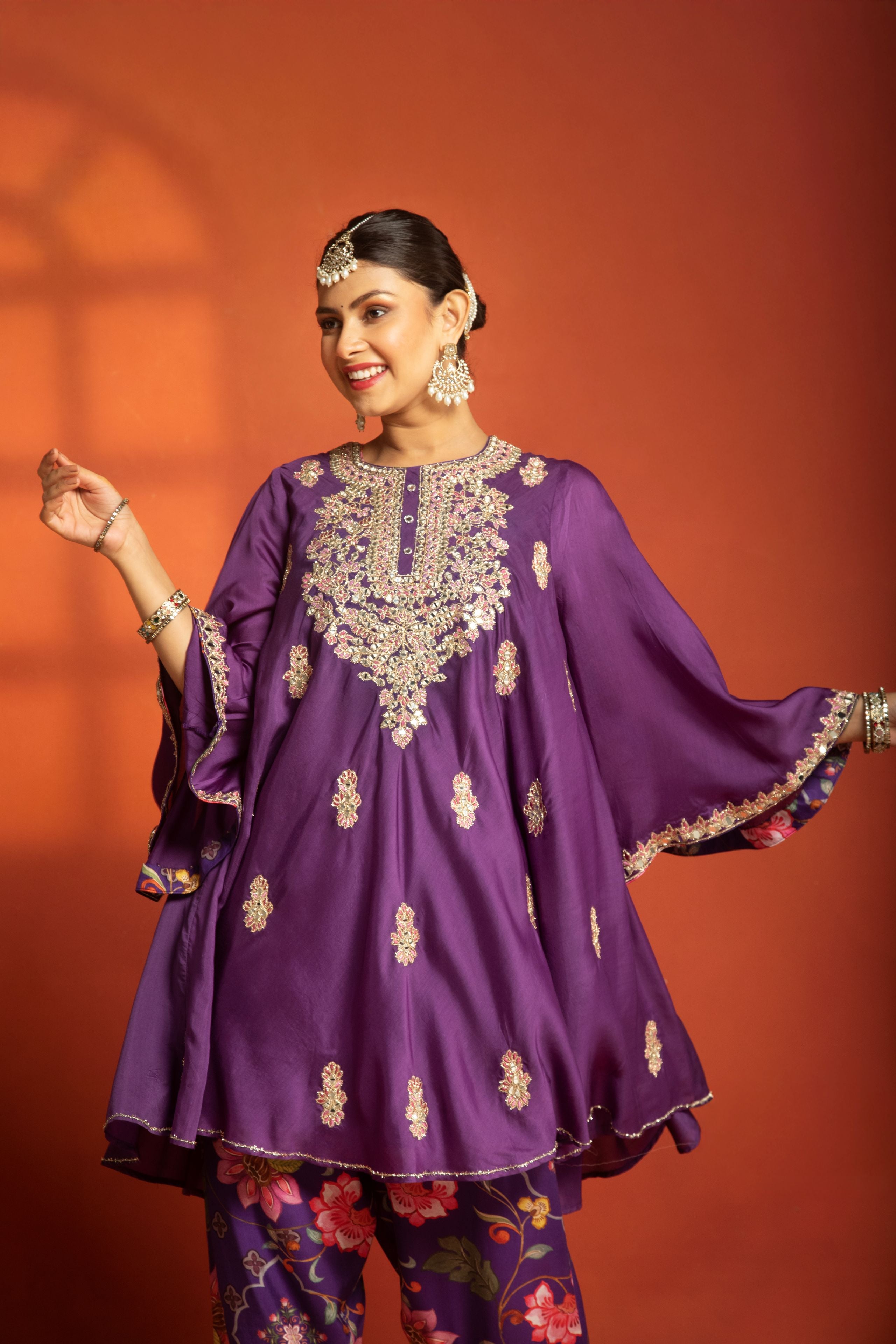 Purple Short Semi- Anarkali with a heavily Embroidered Neckline, Paired with Floral Printed Salwar Pants & Dupatta