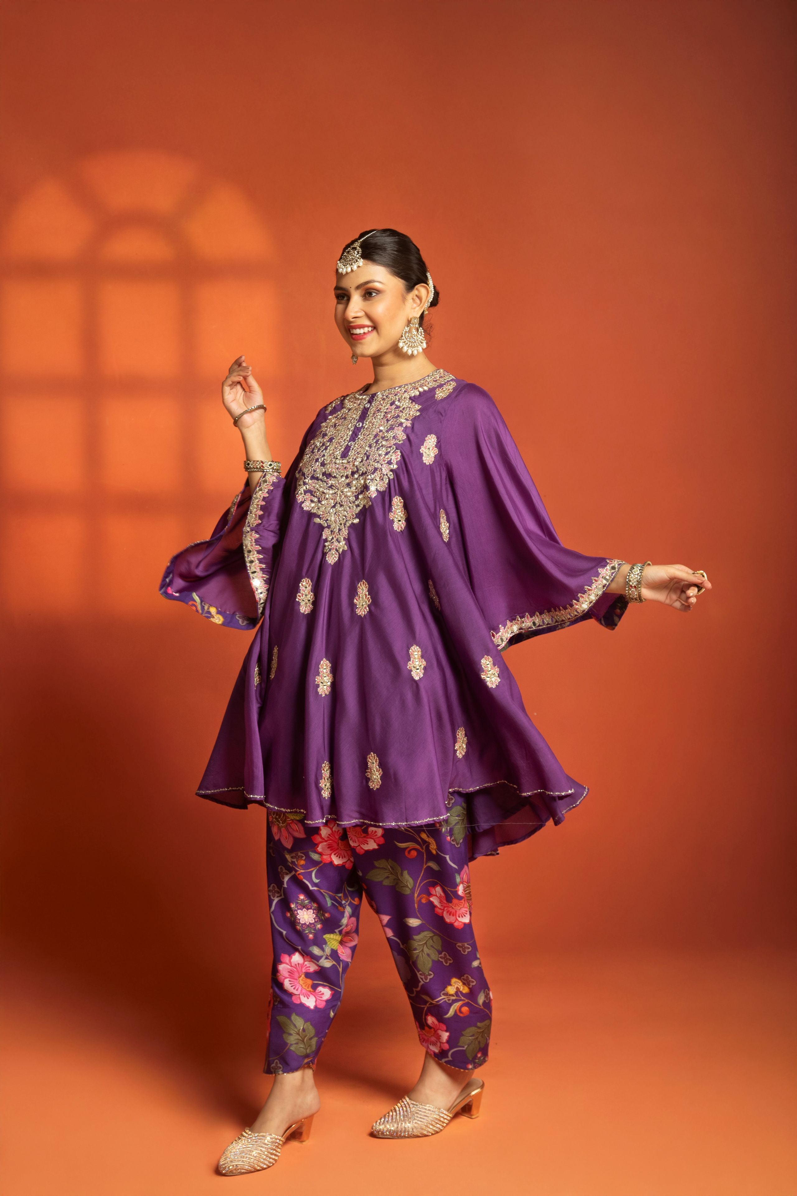 Purple Short Semi- Anarkali with a heavily Embroidered Neckline, Paired with Floral Printed Salwar Pants & Dupatta