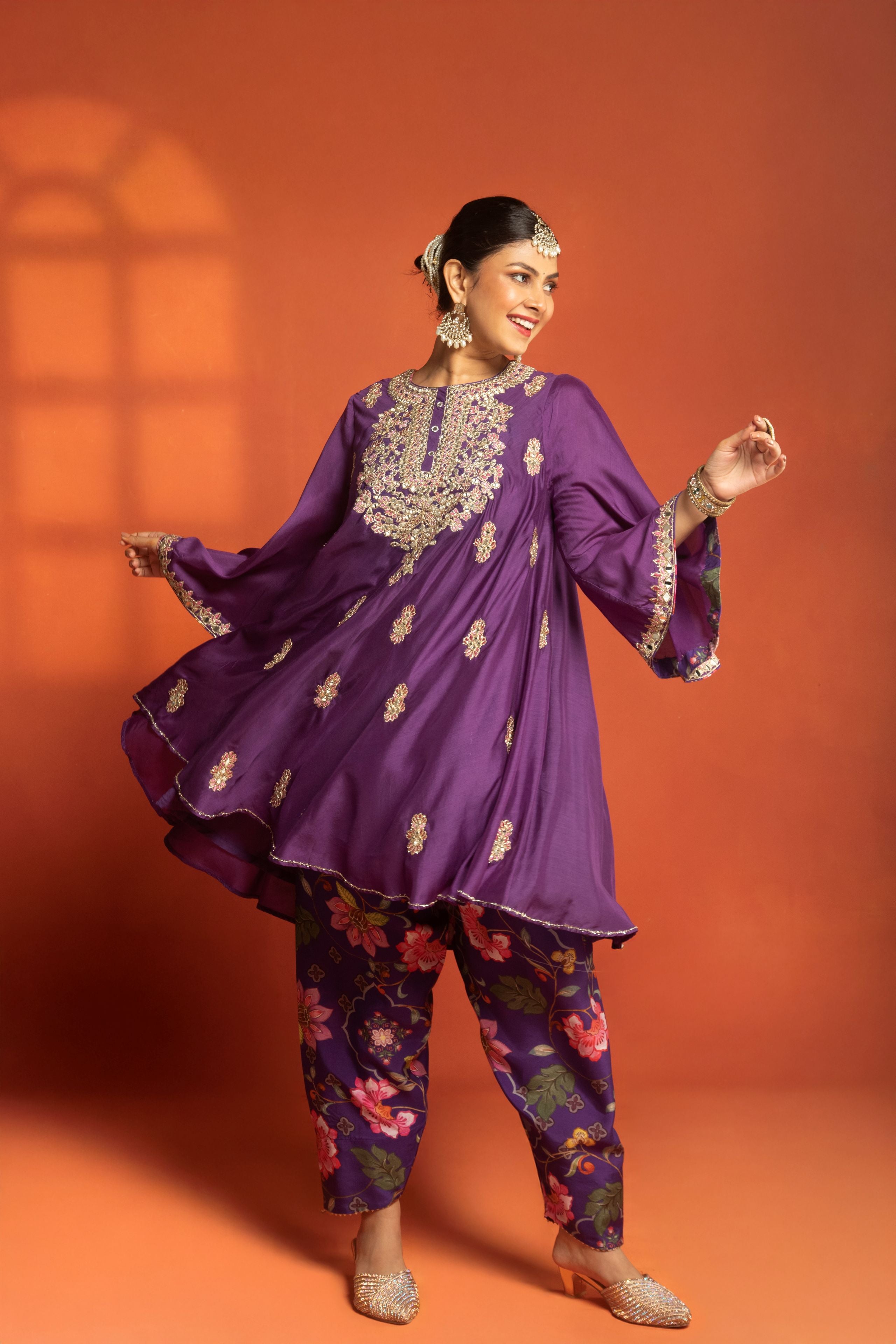Purple Short Semi- Anarkali with a heavily Embroidered Neckline, Paired with Floral Printed Salwar Pants & Dupatta