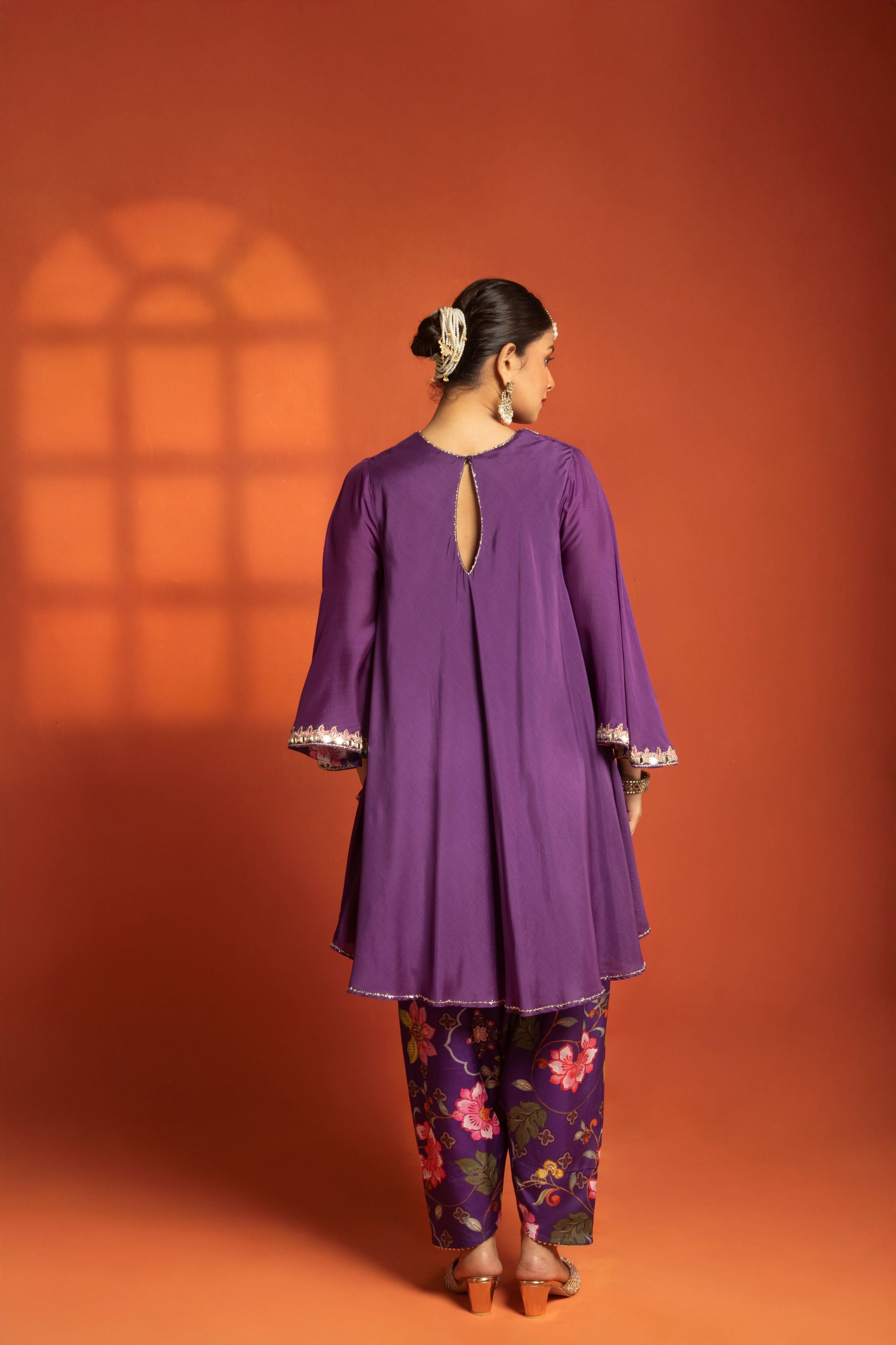 Purple Short Semi- Anarkali with a heavily Embroidered Neckline, Paired with Floral Printed Salwar Pants & Dupatta