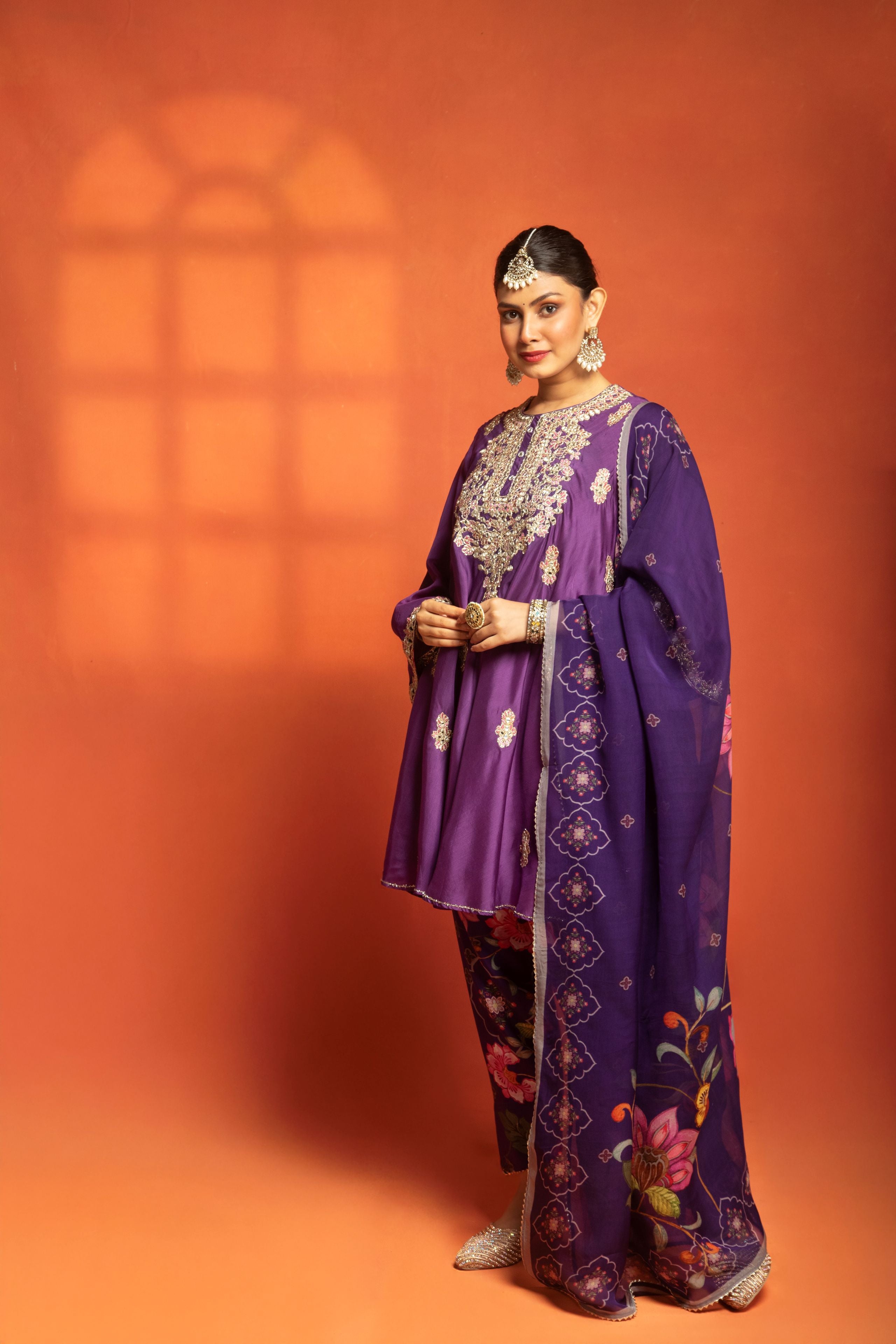 Purple Short Semi- Anarkali with a heavily Embroidered Neckline, Paired with Floral Printed Salwar Pants & Dupatta