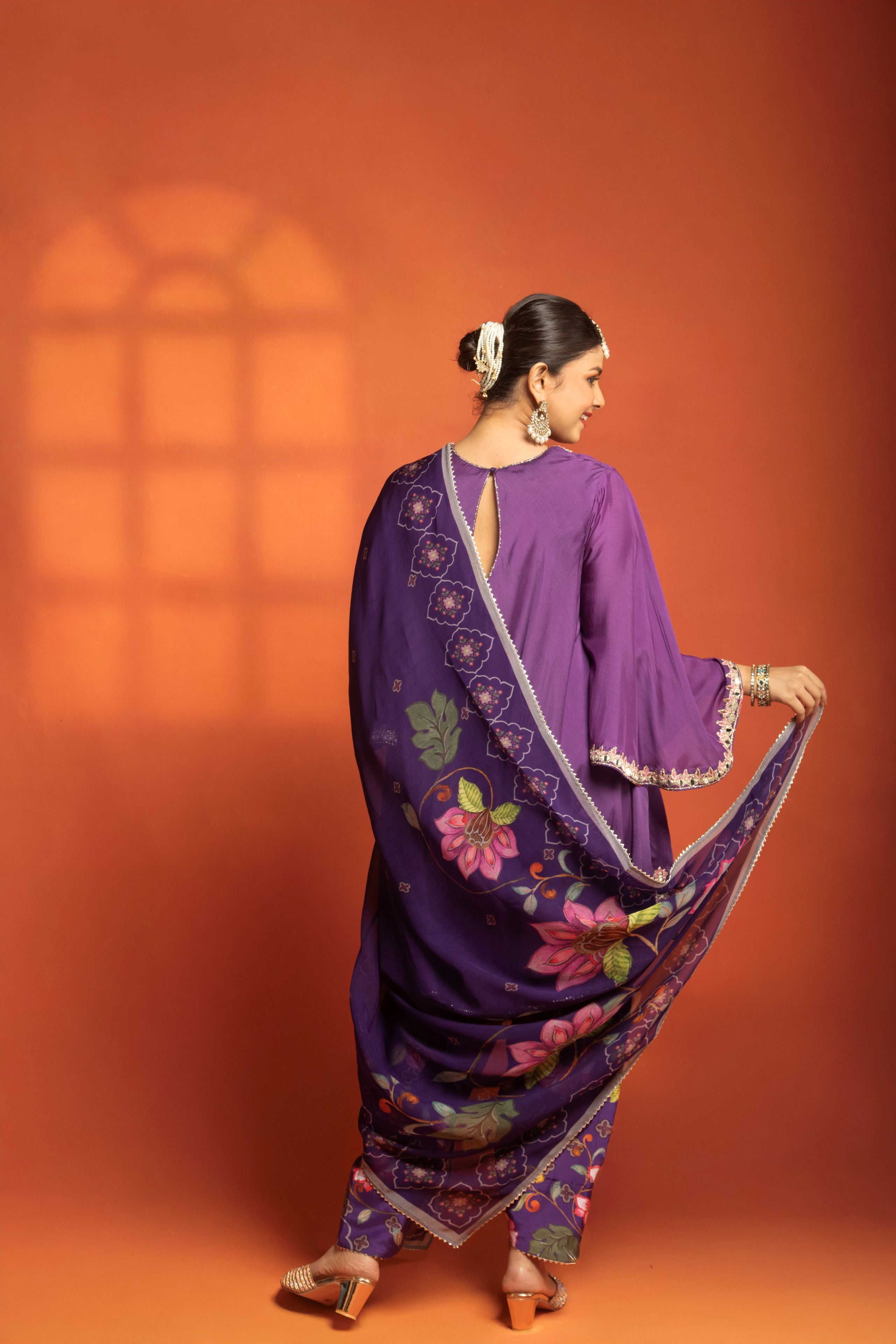 Purple Short Semi- Anarkali with a heavily Embroidered Neckline, Paired with Floral Printed Salwar Pants & Dupatta